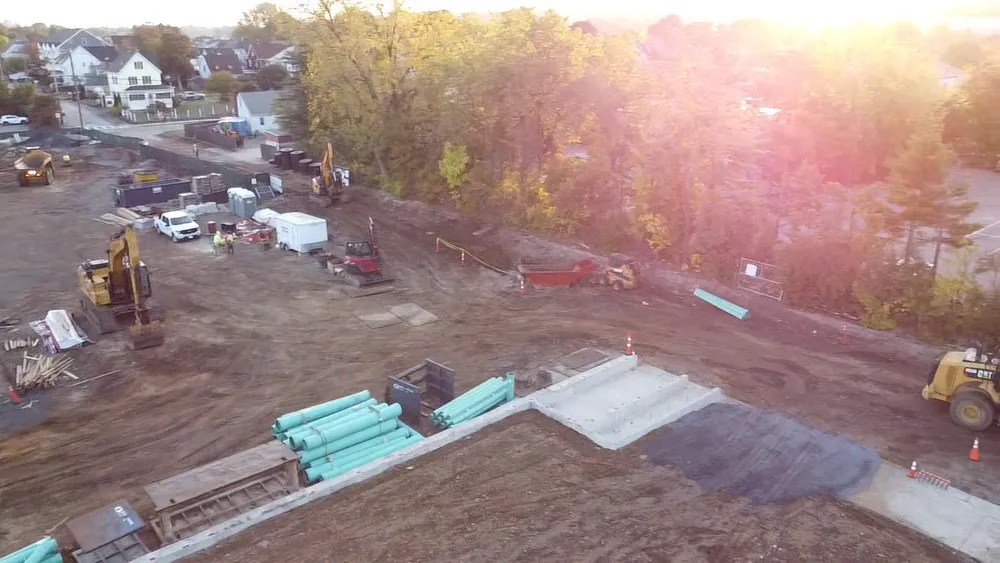 Ashphalt pad being put in